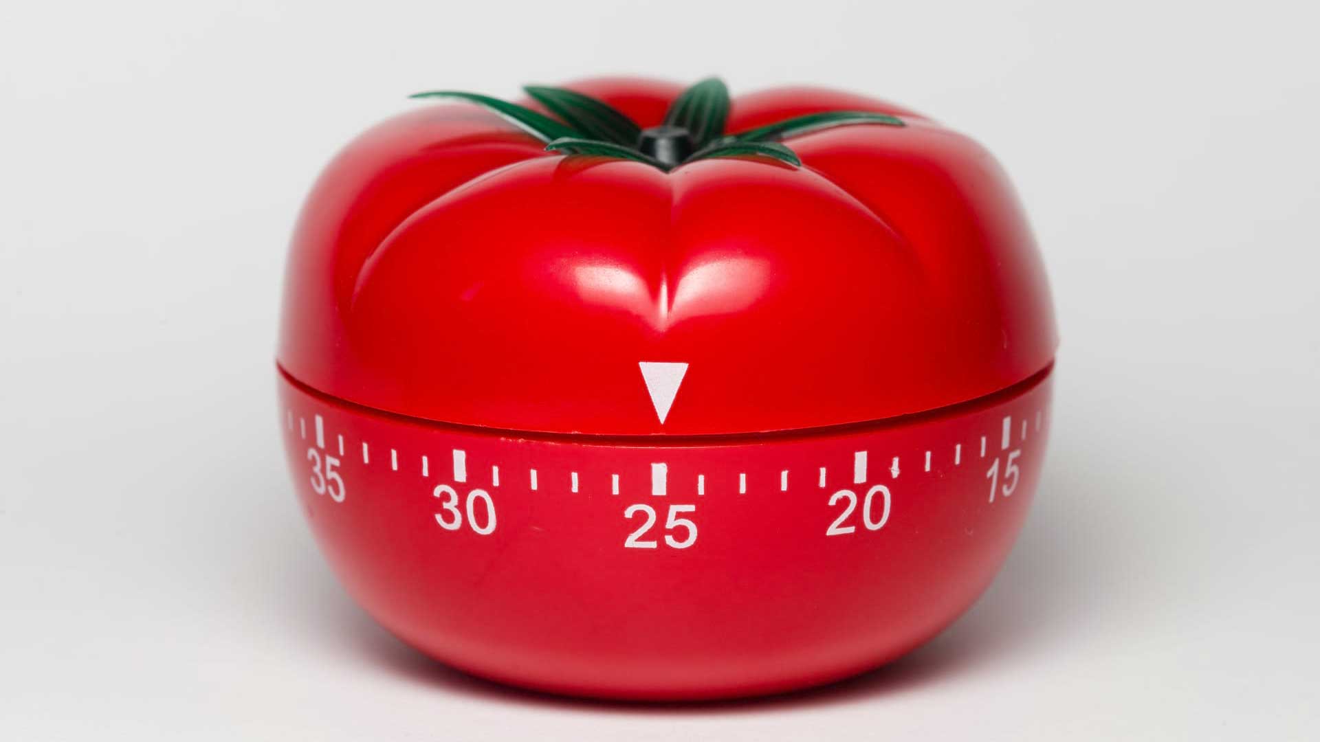 A pomodoro tomato timer set to 25 minutes.